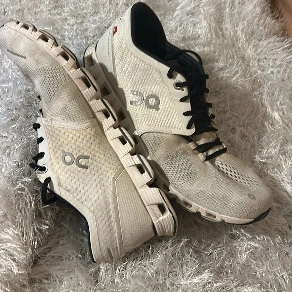 On Running Black and Cream Athletic Shoes